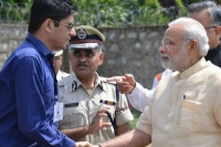 Bastar collector warned for wearing sunglasses while receiving pm modi